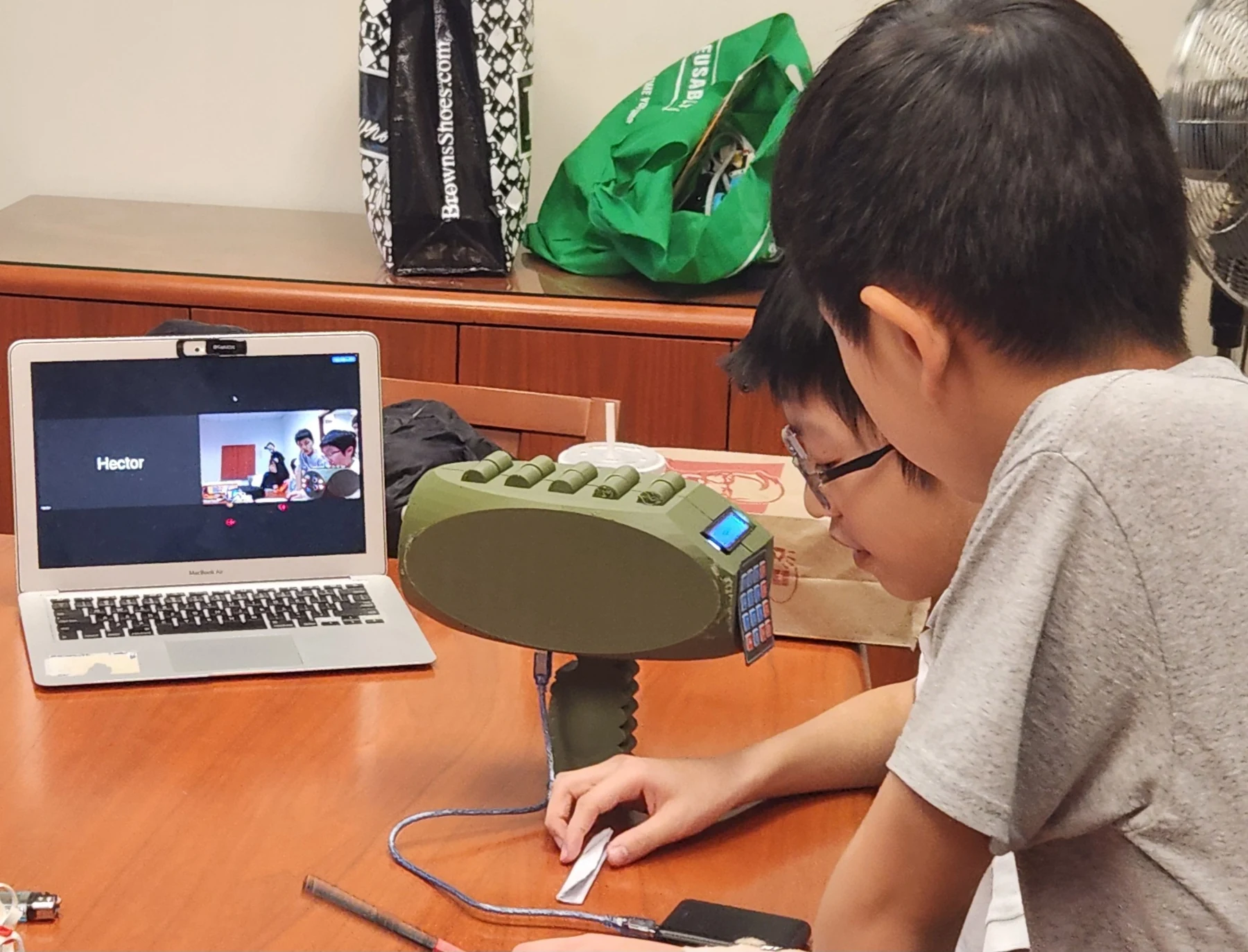 Students developing an engineering project with remote mentorship